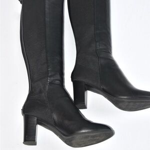 Black Heeled Knee-High Boots Sleek Design